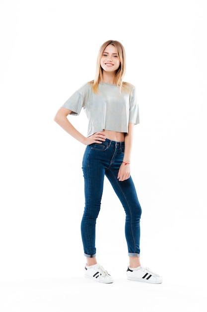 Free photo smiling happy young woman standing and looking
