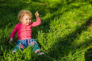 Free photo smiling little boy outdoors