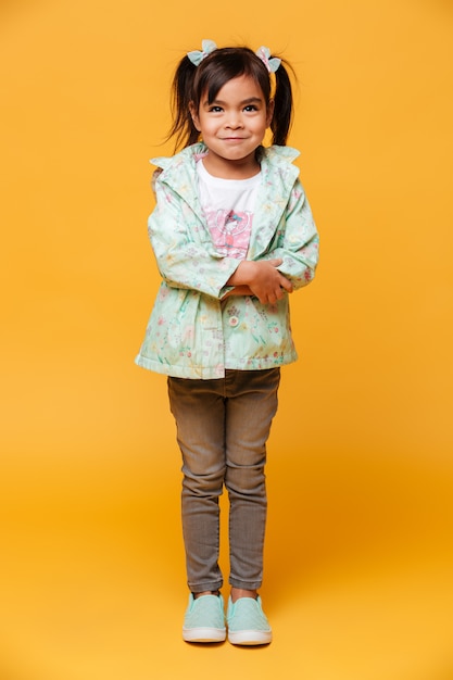 Free photo smiling little girl child standing isolated