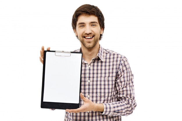 Smiling male employee introduce chart on clipboard