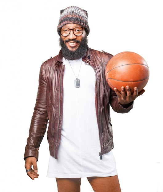 Smiling man holding basketball balls