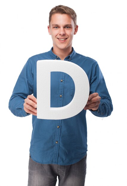 Smiling man holding the letter "d"