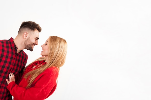 Smiling man leaning forward to woman