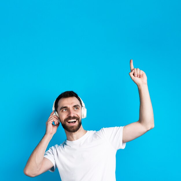 Smiling man listening to music