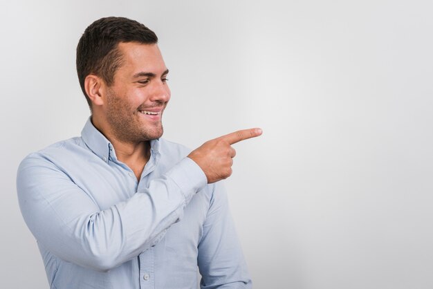 Smiling man looking on one side with copy space