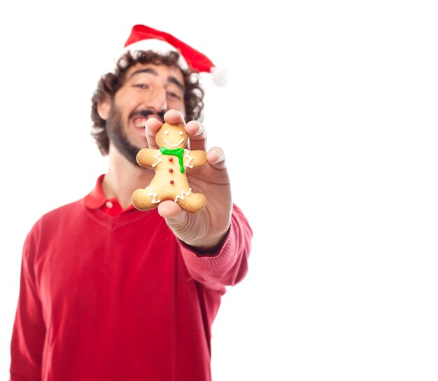 Smiling man playing with his cookie