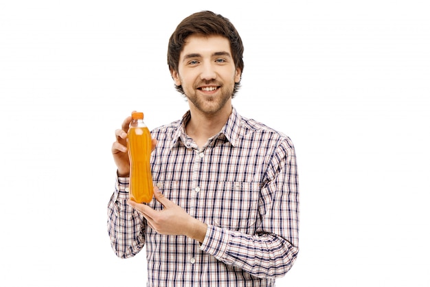 Smiling man showing his favorite soda