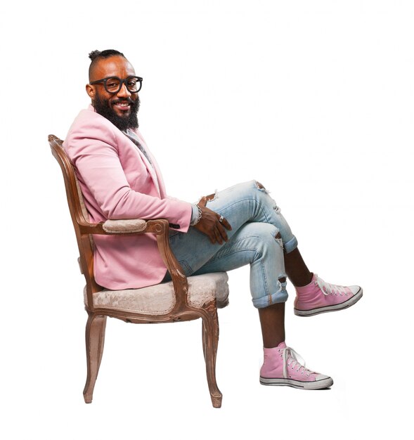 Smiling man sitting on a chair