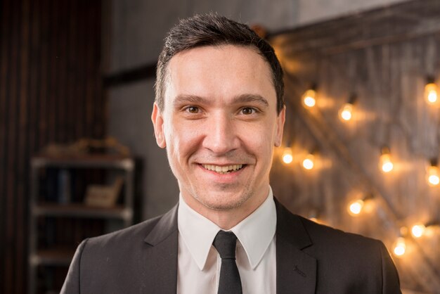 Smiling man in suit looking at camera 