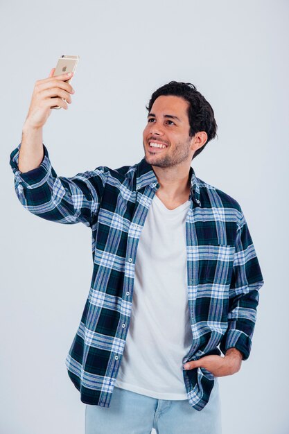 Smiling man taking selfie