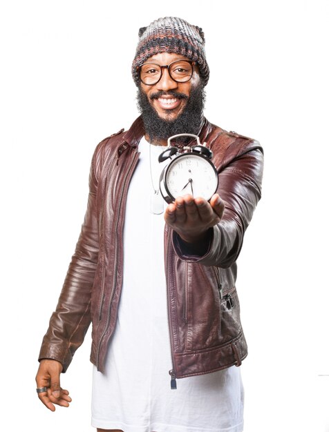 Smiling man with an alarm clock