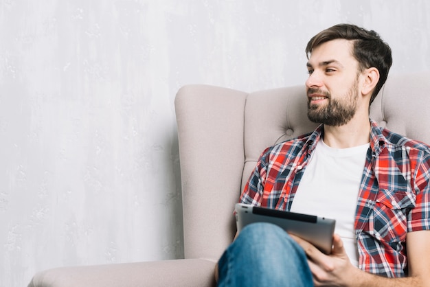 Smiling man with tablet