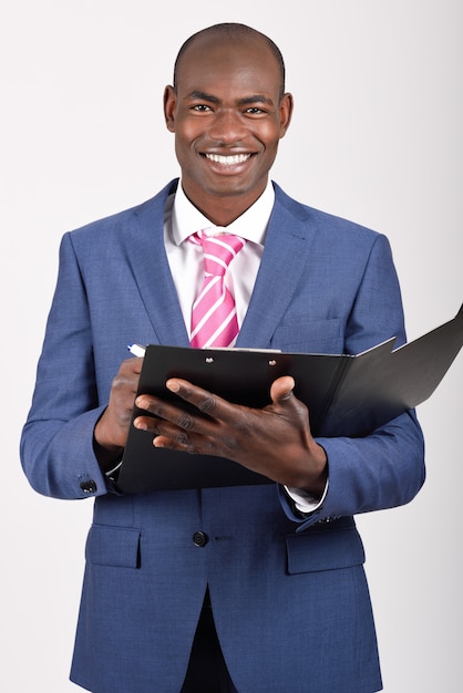 Smiling manager holding a black clipboard