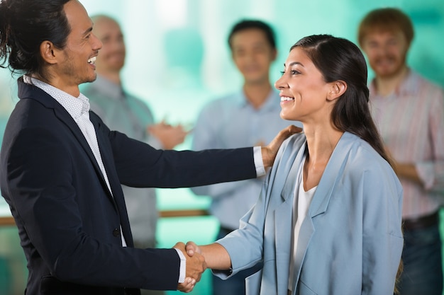 Smiling Middle-aged Business People Shaking Hands