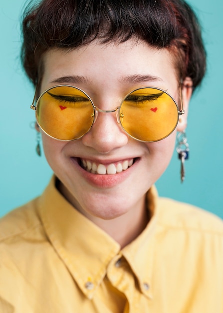 Smiling model wearing yellow glasses