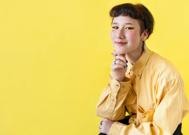 Smiling model on yellow background