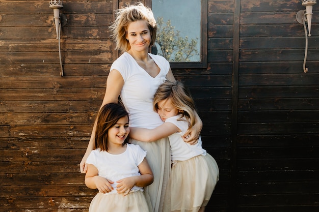 Smiling mother embracing daughter