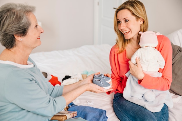 Smiling mother holding baby on mothers day