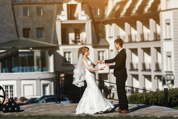 Smiling newlyweds enjoying a sunny day