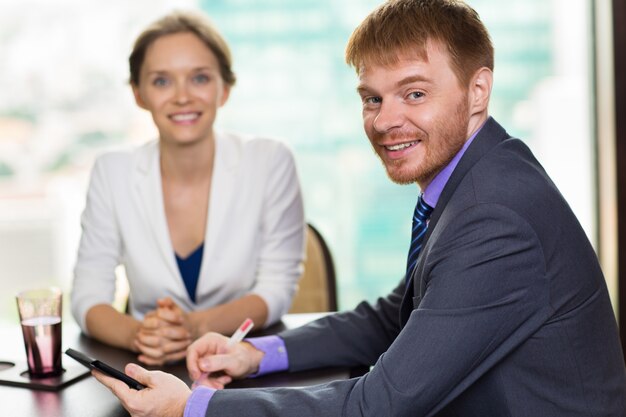 Smiling people dressed smartly