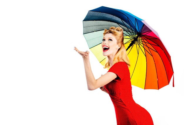 Smiling pinup woman with rain umbrella. rainy rainbow autumn mood, girl isolated white.