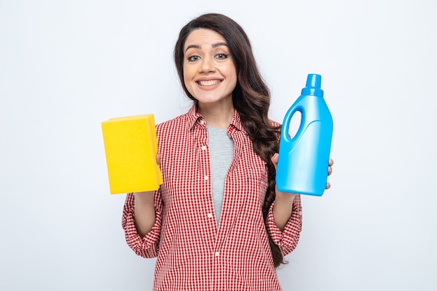 Smiling pretty caucasian cleaner woman holding toilet cleaner liquid and sponge 