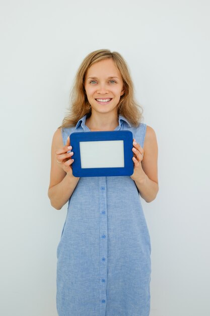 Smiling Pretty Woman Holding Empty Picture Frame