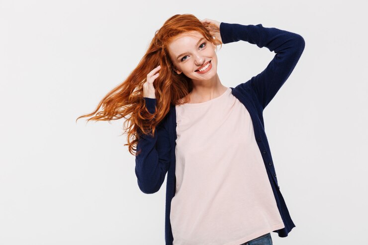 Free Photo smiling pretty young redhead lady