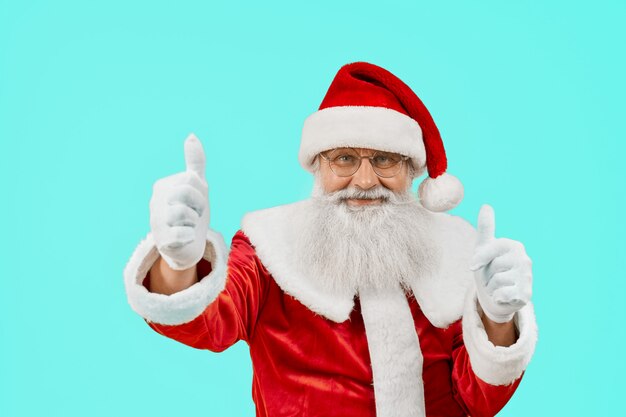 Smiling Santa Claus showing thumbs up.