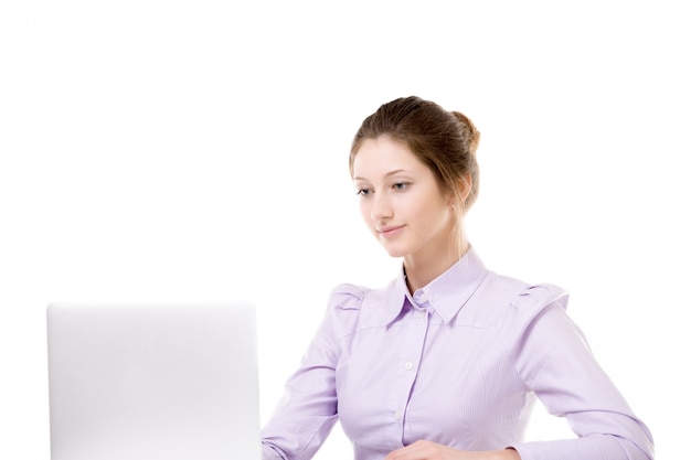 Smiling secretary working with laptop