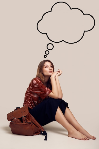 Smiling student hipster woman with backpack going on a vacation