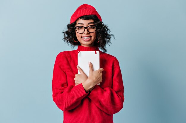 Smiling student with dental braces looking at front