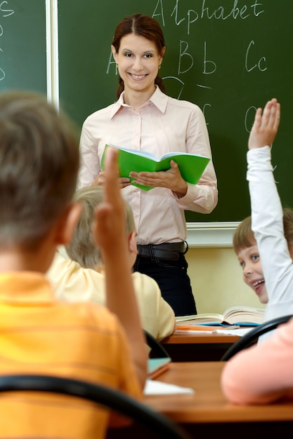 Smiling teacher with pupils