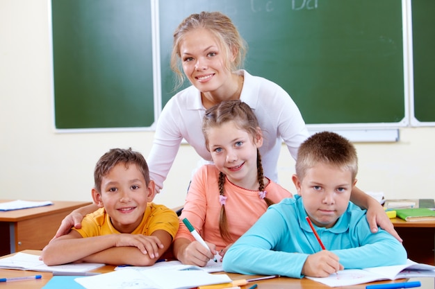 Smiling teacher with students