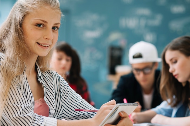 Smiling teen girl educating