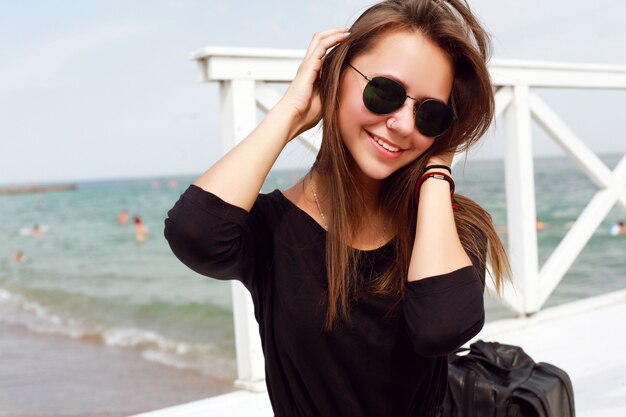 Smiling teenager posing at the pier