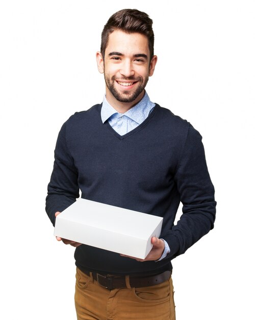 Smiling teenager posing with a package