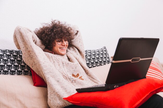 Smiling teenager with laptop