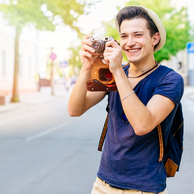 Smiling tourist with camera