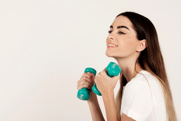 Smiling with dumbbells