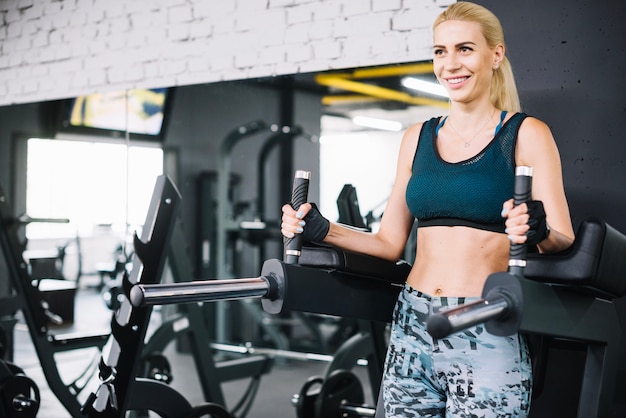 Smiling woman on exercise machine