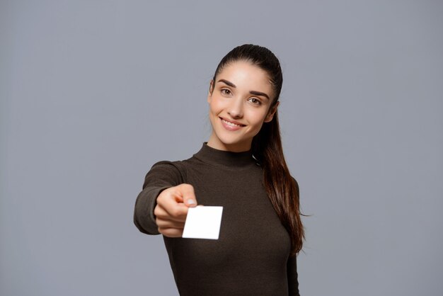 Smiling woman give her business card