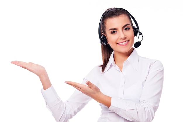 Smiling woman in headset presentation something