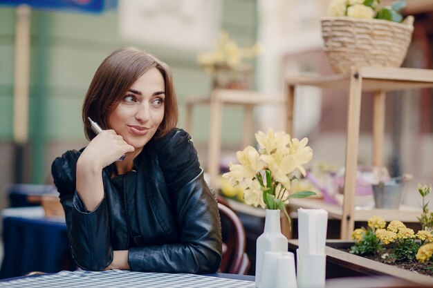 Smiling woman holding an electronic cigarette