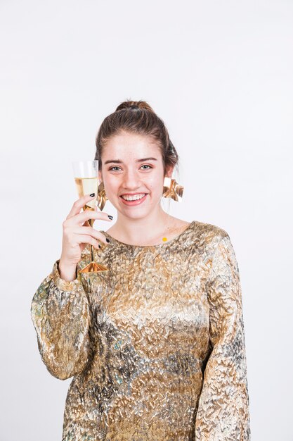 Smiling woman holding glass of champagne