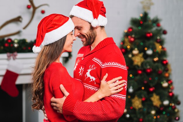 Smiling woman hugging man