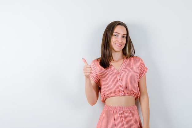 The smiling woman is showing perfect gesture on white background