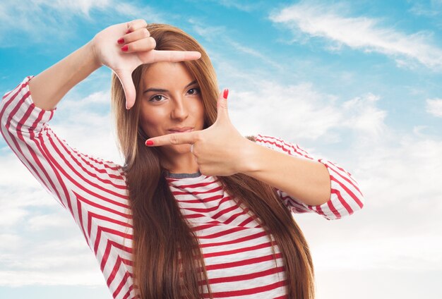 Smiling woman masking photo gesture