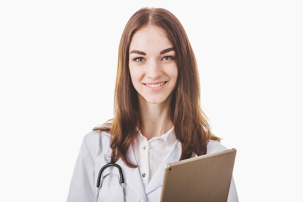 Smiling woman medic holding tablet