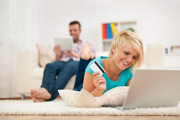 Smiling woman and online shopping at home